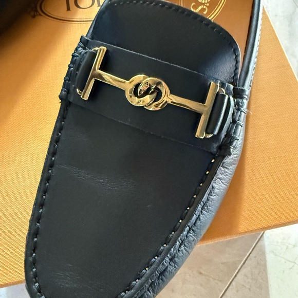 Tod\'s Black Leather Loafers with Gold Accent